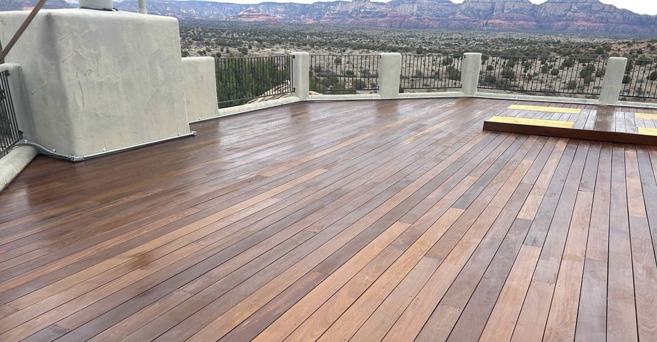 Glossy hardwood deck with expansive desert views, crafted by Crosby Home Services in Prescott, AZ