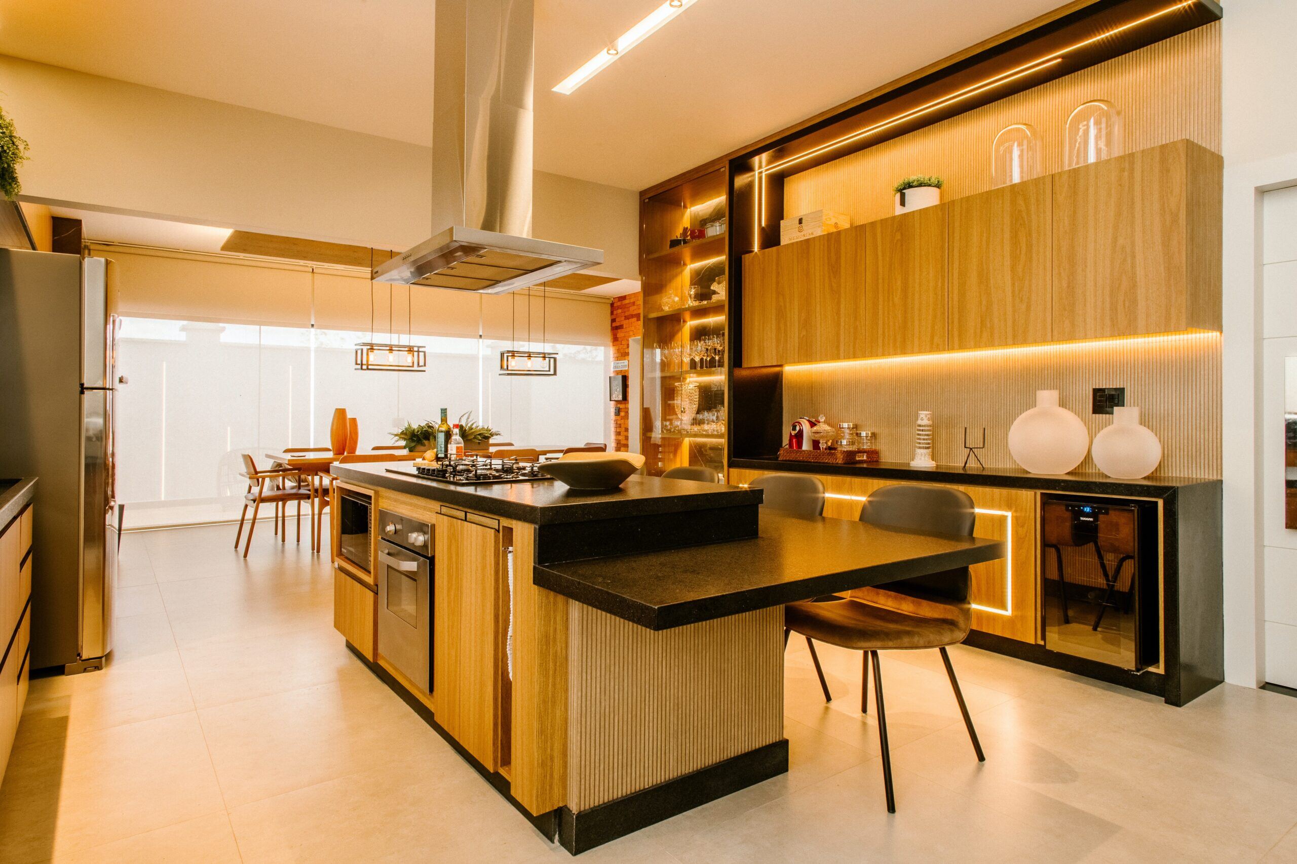 spacious, modern kitchen remodel with warm finishes and custom lighting