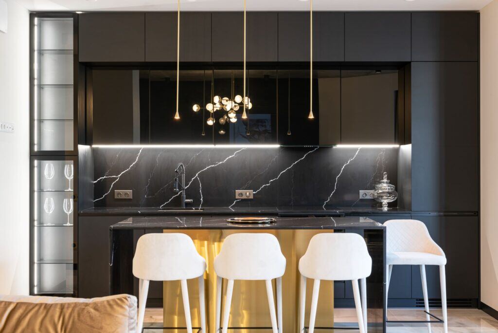 sleek modern kitchen remodel with black cabinets and countertops