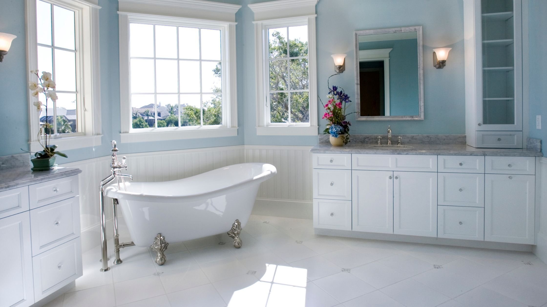 arizona master bathroom with free standing bathtub and blue and white color palette