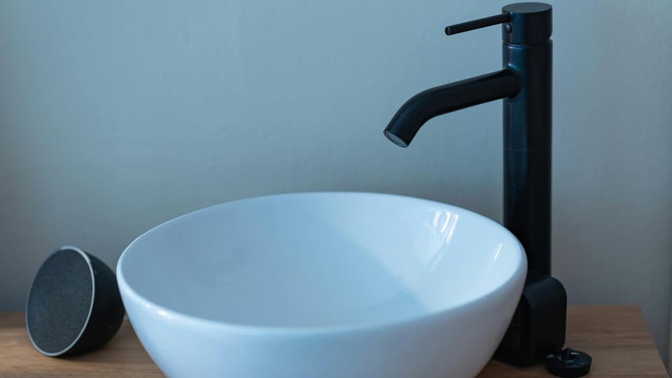 black and white modern farmhouse bathroom with white vessel sink