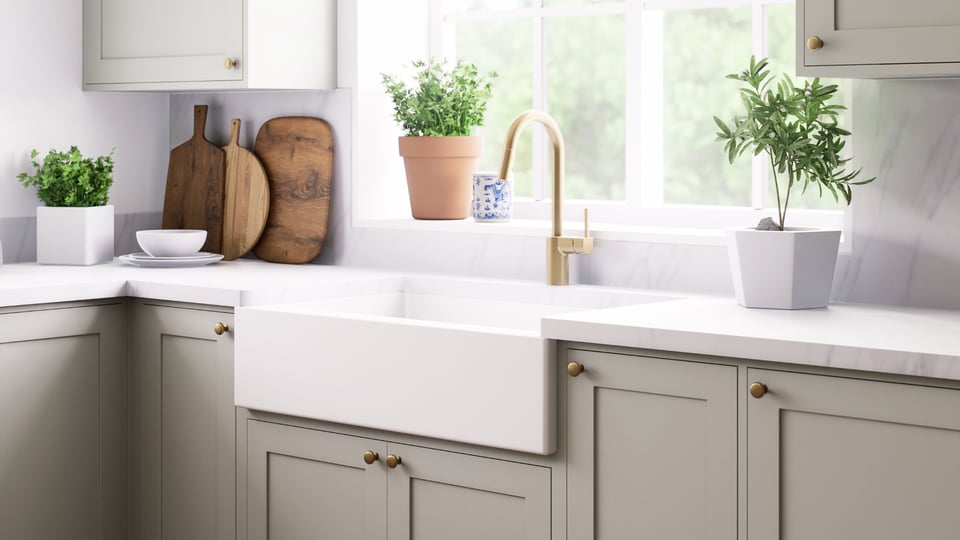 brushed gold hardware and sage green cabinets in an arizona kitchen renovation