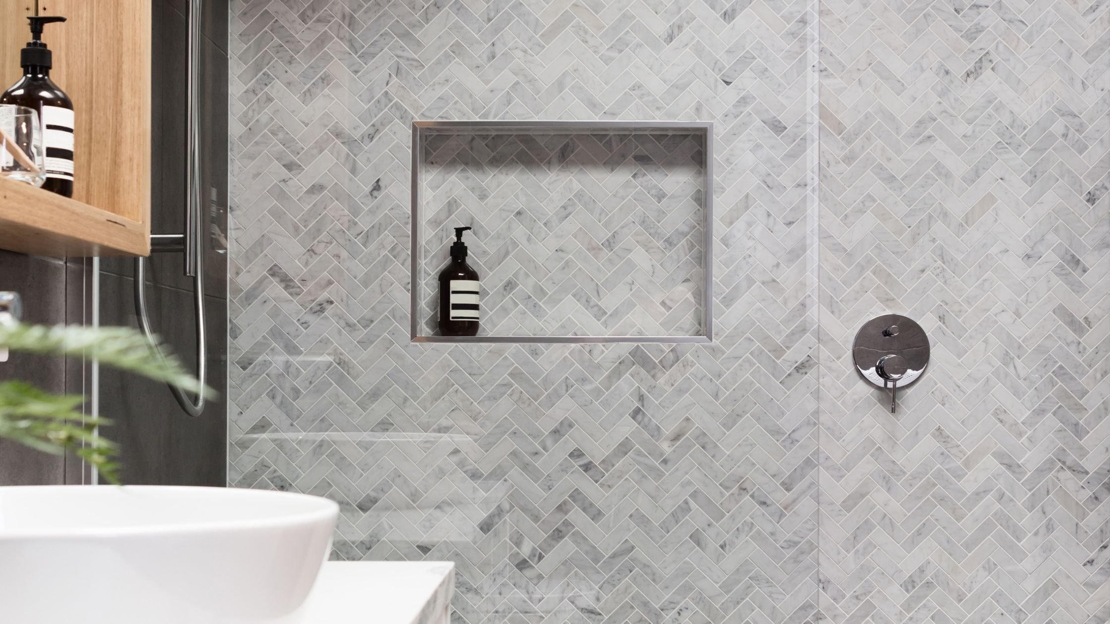 chevron bathroom tile in a walk-in shower in arizona