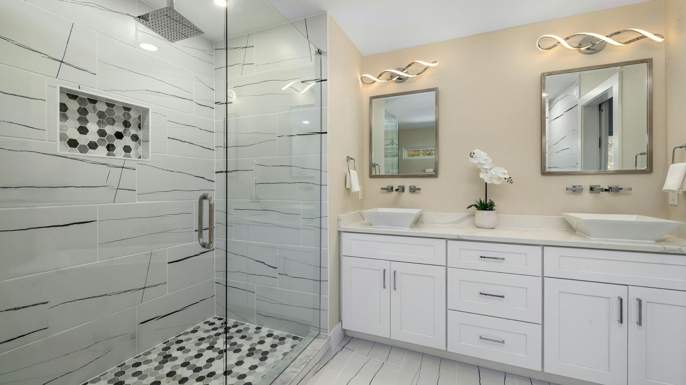 large shower tile with black and white graining in an arizona bathroom remodel with double sink vanity