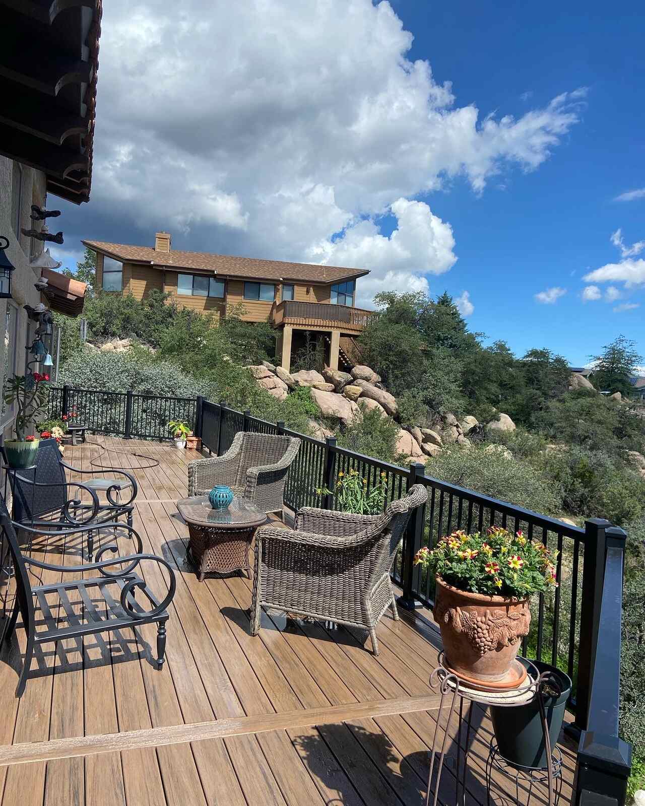 Cozy deck space overlooking Prescott, AZs natural beauty, designed by Crosby Home Services with elegant finishes