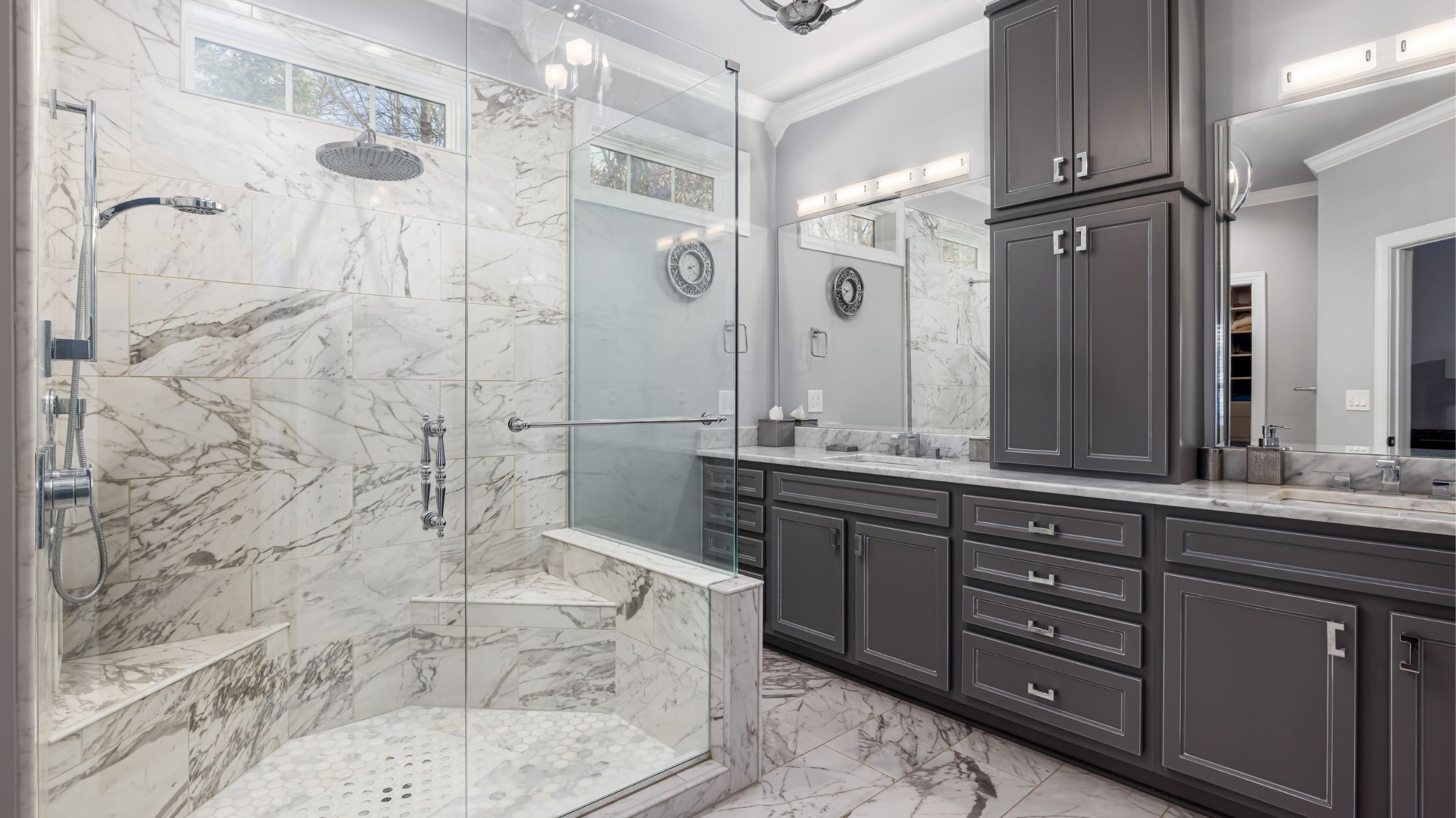 spa-like bathroom with rainfall showerhead and custom vanity with storage
